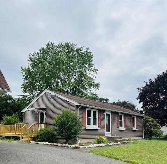 209 Casey Dr, Chicopee, MA 01020 - single story home with a wooden deck and a front lawn