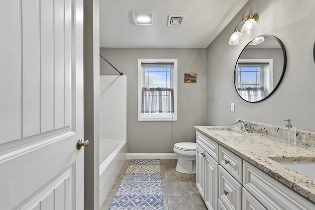 10 Stone St Unit 1, Auburn, MA 01501 - full bath with baseboards, double vanity, toilet, visible vents, and a sink
