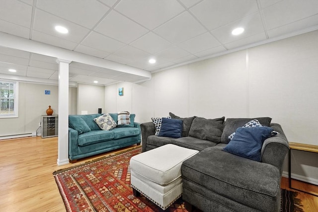 10 Stone St Unit 1, Auburn, MA 01501 - living area with baseboard heating, a paneled ceiling, wood finished floors, and beverage cooler