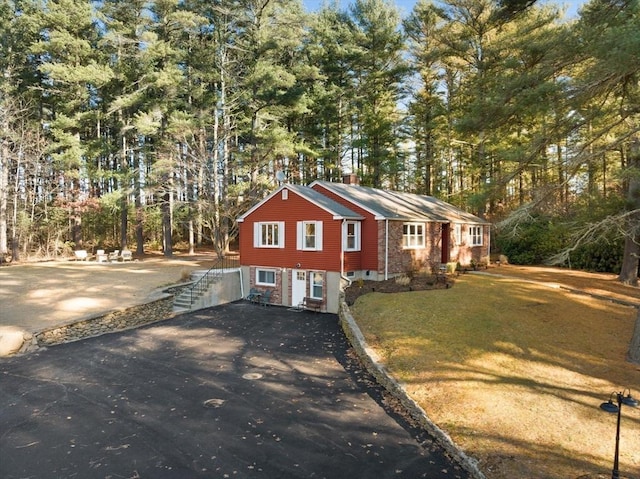 92 Martin St, Rehoboth, MA 02769 - view of property exterior featuring asphalt driveway, a yard, and view of scattered trees