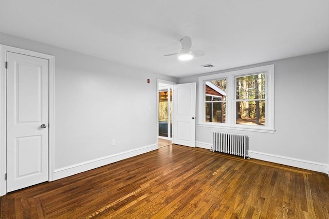 92 Martin St, Rehoboth, MA 02769 - empty room featuring radiator heating unit, wood finished floors, and ceiling fan