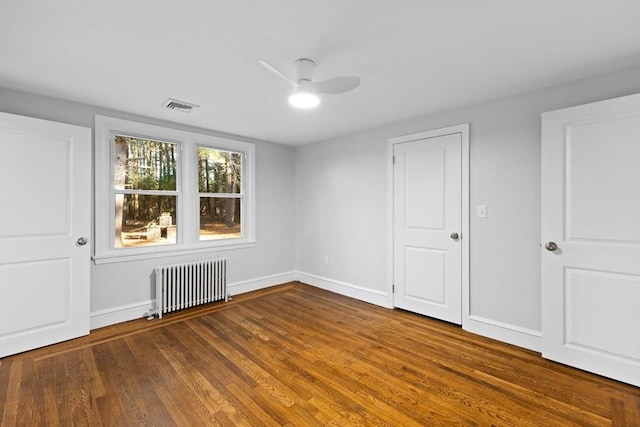 92 Martin St, Rehoboth, MA 02769 - unfurnished bedroom featuring radiator heating unit, wood finished floors, and a ceiling fan