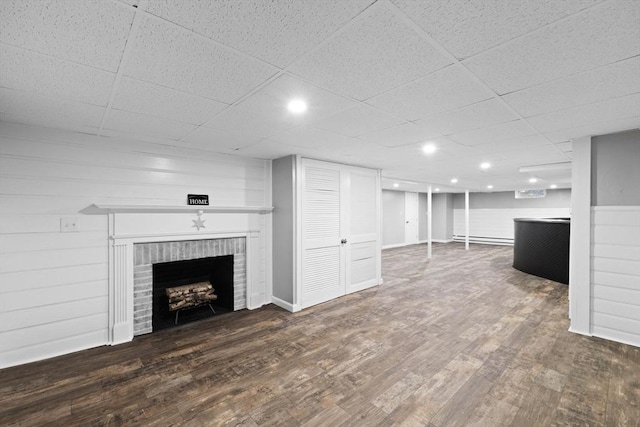 92 Martin St, Rehoboth, MA 02769 - unfurnished living room with a brick fireplace, wood finished floors, and a drop ceiling