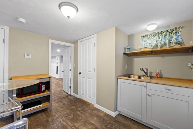 92 Martin St, Rehoboth, MA 02769 - indoor wet bar featuring dark wood-style flooring and baseboards