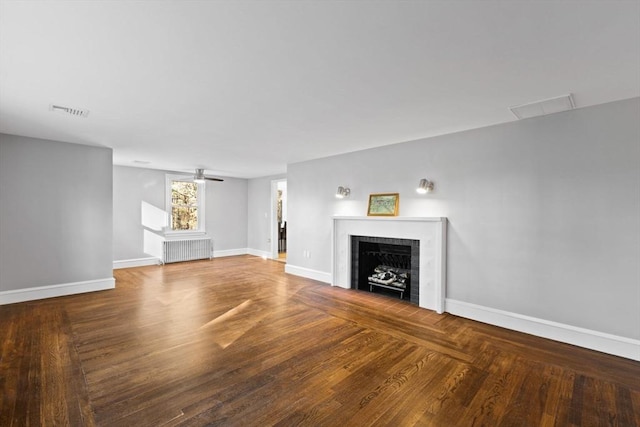 92 Martin St, Rehoboth, MA 02769 - unfurnished living room featuring radiator heating unit, a fireplace, and wood finished floors