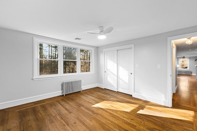 92 Martin St, Rehoboth, MA 02769 - unfurnished bedroom with radiator, wood finished floors, a closet, and ceiling fan