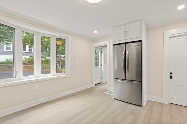 25 Norfolk St, Canton, MA 02021 - kitchen with freestanding refrigerator, light wood-type flooring, white cabinetry, crown molding, and recessed lighting