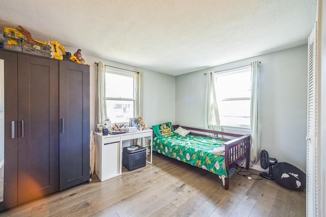 14 Greenville St, Billerica, MA 01821 - bedroom with a textured ceiling and light wood-style flooring