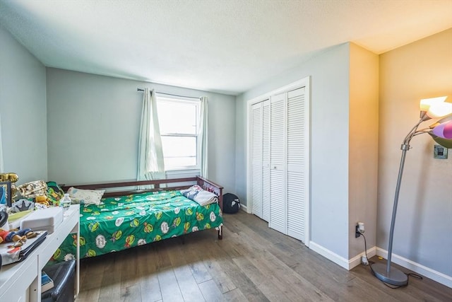 14 Greenville St, Billerica, MA 01821 - bedroom featuring a closet, baseboards, and wood finished floors