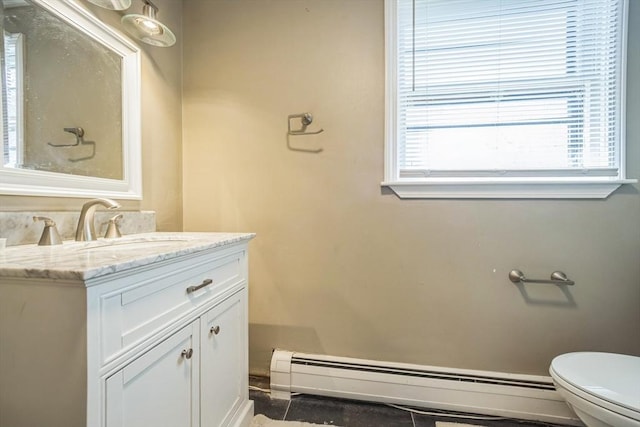 14 Greenville St, Billerica, MA 01821 - bathroom featuring vanity, baseboard heating, and toilet