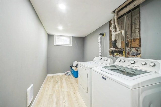 14 Greenville St, Billerica, MA 01821 - washroom with laundry area, separate washer and dryer, light wood-style flooring, baseboards, and visible vents