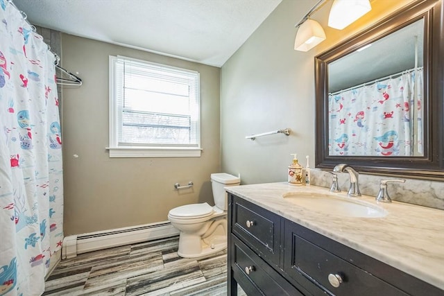 14 Greenville St, Billerica, MA 01821 - bathroom with a shower with curtain, wood finished floors, vanity, a baseboard heating unit, and toilet