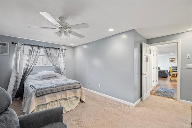 bedroom featuring carpet, a ceiling fan, baseboards, recessed lighting, and a wall mounted AC