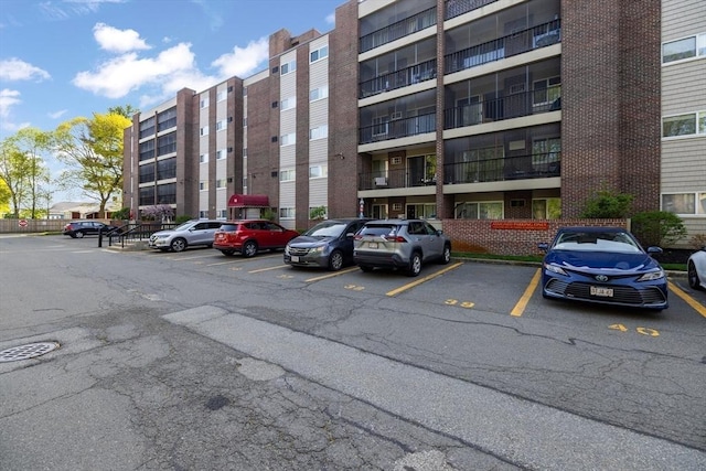 view of property featuring uncovered parking