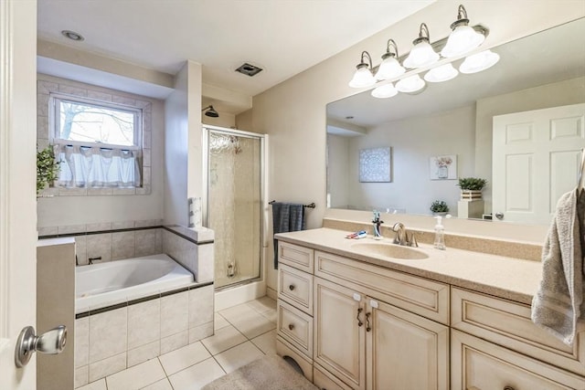 bathroom featuring tile patterned floors, separate shower and tub, and vanity