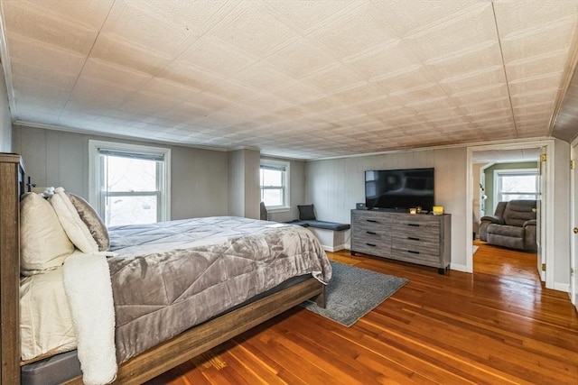 bedroom with hardwood / wood-style flooring