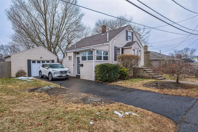 view of front of property with an outbuilding and a garage