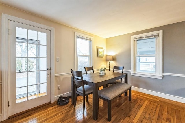 dining space featuring hardwood / wood-style floors