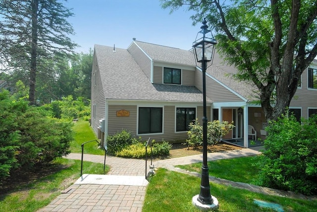 19 Concord Greene Unit 3, Concord, MA 01742 - back of house with roof with shingles and a lawn
