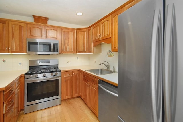 19 Concord Greene Unit 3, Concord, MA 01742 - kitchen with appliances with stainless steel finishes, light wood-type flooring, light countertops, tasteful backsplash, and recessed lighting