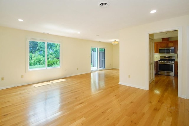 19 Concord Greene Unit 3, Concord, MA 01742 - unfurnished living room featuring light wood-style floors and recessed lighting