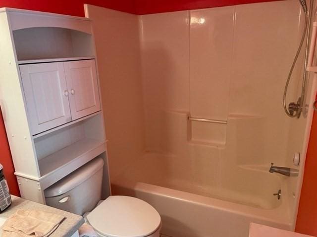 full bath with toilet and shower / bath combination