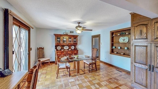 242 Eastwood Dr, Westfield, MA 01085 - dining space featuring a ceiling fan, a textured ceiling, and baseboards