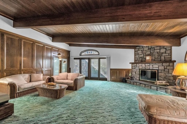 242 Eastwood Dr, Westfield, MA 01085 - living room with beam ceiling, carpet, a wainscoted wall, a fireplace, and a decorative wall