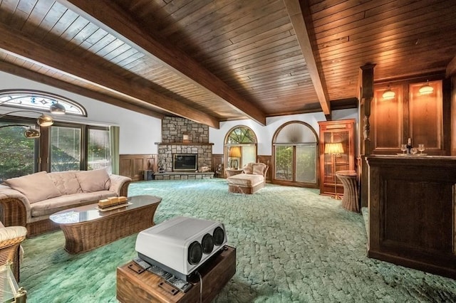 242 Eastwood Dr, Westfield, MA 01085 - carpeted living area featuring a wainscoted wall, beam ceiling, a fireplace, and wooden ceiling