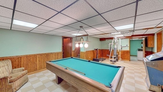 242 Eastwood Dr, Westfield, MA 01085 - playroom featuring tile patterned floors, a wainscoted wall, wood walls, a dry bar, and a paneled ceiling