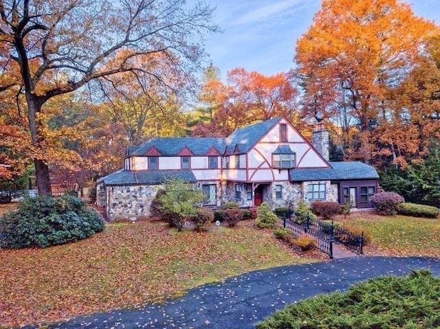 242 Eastwood Dr, Westfield, MA 01085 - view of front of property featuring a chimney, stone siding, and fence