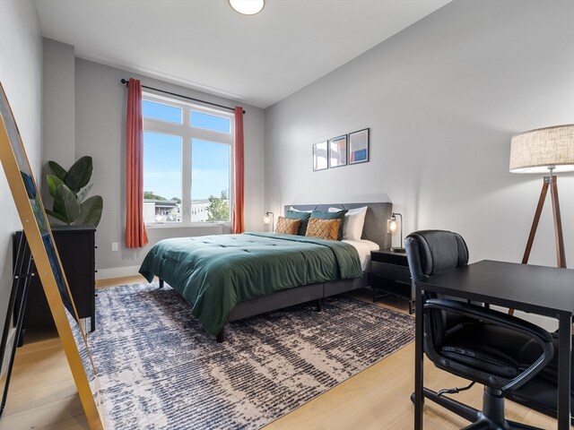 bedroom with hardwood / wood-style floors