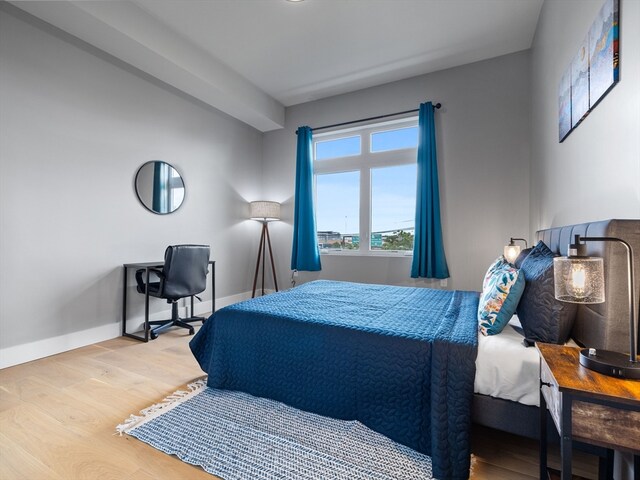 bedroom with light hardwood / wood-style flooring