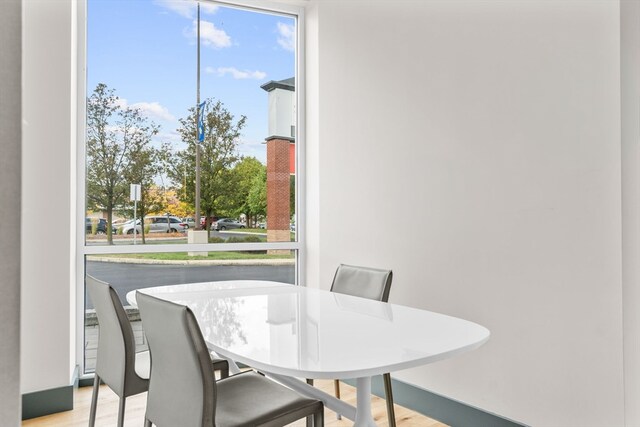 dining area with light hardwood / wood-style floors