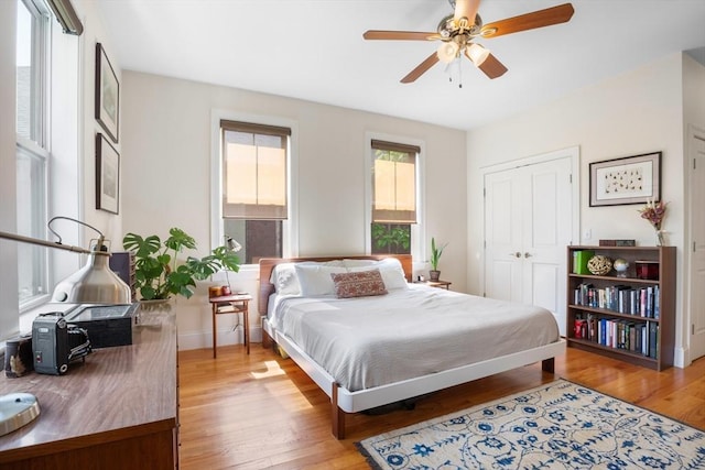 129 Highland Ave Unit 4, Somerville, MA 02143 - bedroom featuring light wood-type flooring, a ceiling fan, and a closet