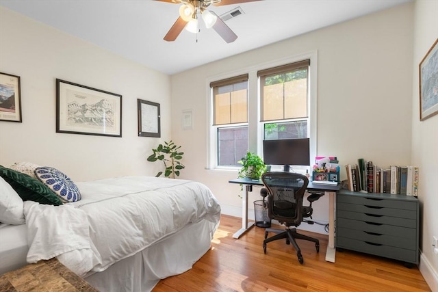 129 Highland Ave Unit 4, Somerville, MA 02143 - bedroom with wood finished floors, an office area, and a ceiling fan