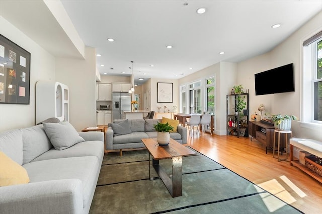129 Highland Ave Unit 4, Somerville, MA 02143 - living area featuring light wood-type flooring and recessed lighting