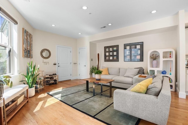 129 Highland Ave Unit 4, Somerville, MA 02143 - living room featuring light wood finished floors and recessed lighting