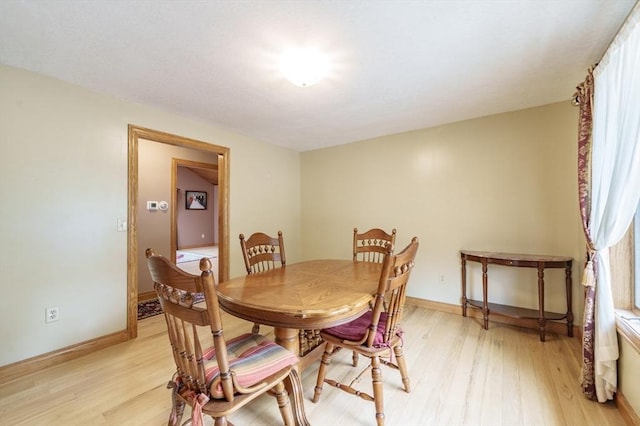 1170 E St, Ludlow, MA 01056 - dining space with light wood-style floors and baseboards