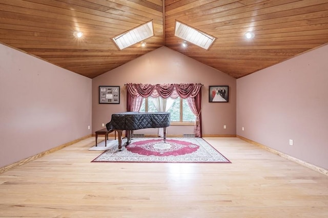1170 E St, Ludlow, MA 01056 - living area with a skylight, light wood-style floors, vaulted ceiling, and wood ceiling