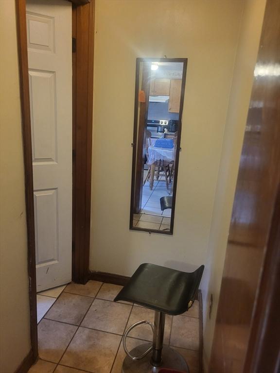 21 Delford Unit 2, Boston, MA 02131 - corridor featuring light tile patterned flooring and baseboards