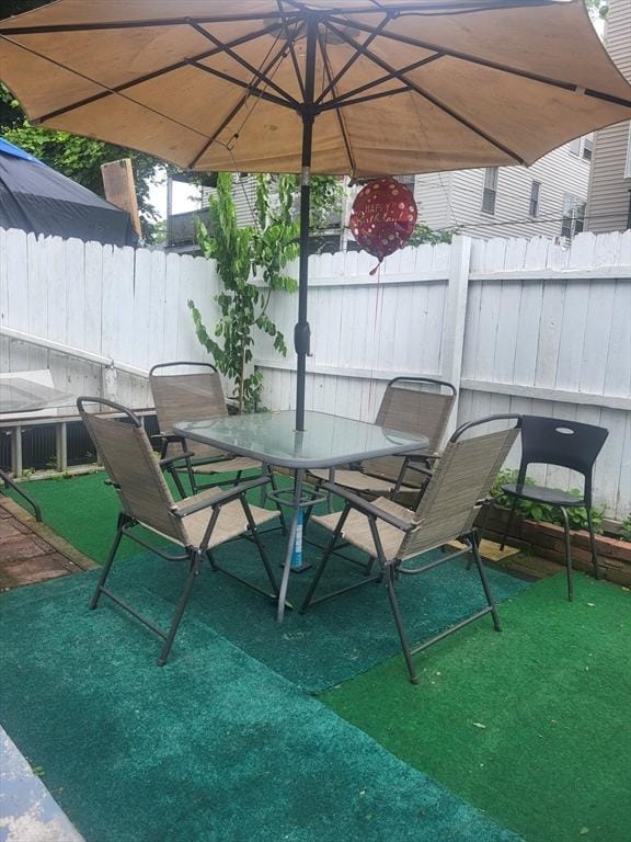 21 Delford Unit 2, Boston, MA 02131 - view of patio / terrace with outdoor dining space