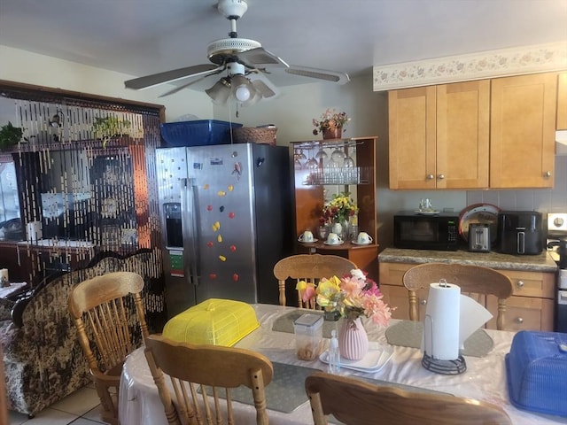 21 Delford Unit 2, Boston, MA 02131 - kitchen with stainless steel fridge, black microwave, ceiling fan, and tile patterned flooring