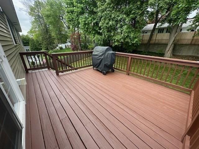 wooden terrace with area for grilling