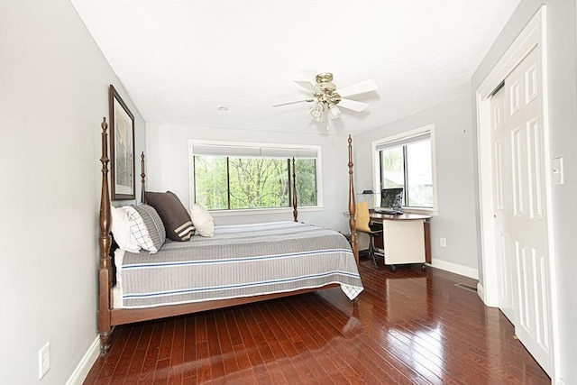 bedroom with wood-type flooring, baseboards, and ceiling fan