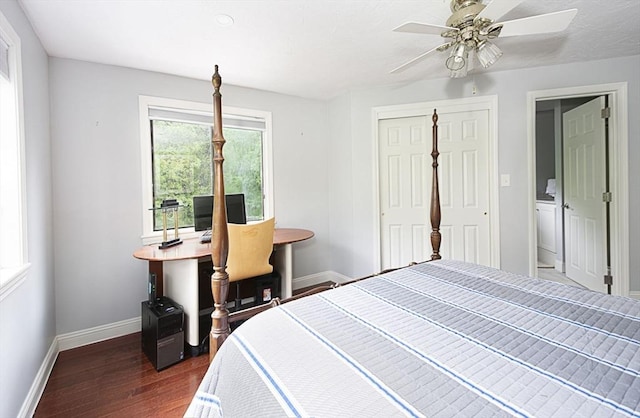 bedroom featuring dark wood-style flooring, baseboards, a closet, and ceiling fan