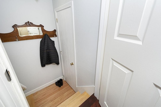 interior space featuring wood finished floors and baseboards