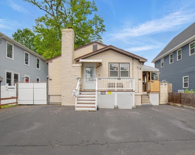 26 Hanna St, Quincy, MA 02169 - view of front facade with a chimney