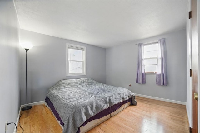 26 Hanna St, Quincy, MA 02169 - bedroom featuring multiple windows, wood finished floors, and baseboards