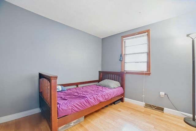 26 Hanna St, Quincy, MA 02169 - bedroom featuring baseboards and wood finished floors